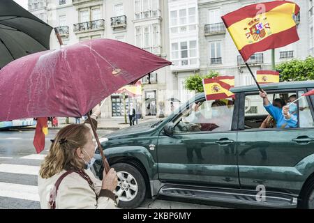 Protesters with spanish flags in the car during a demonstration in Santander, Spain, on May 23, 2020 against the government of Spain because the management of the covid-19 crisis. Demonstration is supported by the right wing protesters. (Photo by Celestino Arce/NurPhoto) Stock Photo