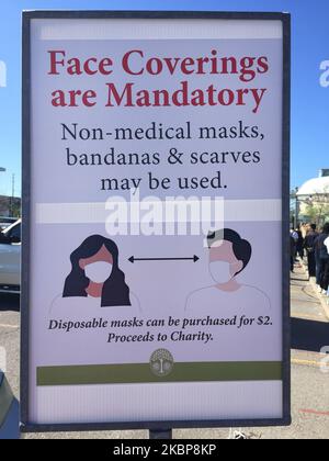 Sign telling people they must wear face masks or face coverings to protect from the novel coronavirus (COVID-19) at a garden centre during the Spring season in Toronto, Ontario, Canada on May 20, 2020. Health officials announced today that non-medical face masks are recommended to be worn in public when social distancing (physical distancing) may not be possible. (Photo by Creative Touch Imaging Ltd./NurPhoto) Stock Photo