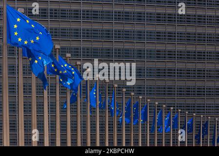 Flags of the European Union fly in the wind at the main building of the European Commission in Brussels - Belgium on 28 May 2020. European Commission President Ursula von der Leyen proposes that the European Union invest 750 billion euros in countries that are suffering economically from the corona crisis. The plan will be called Next Generation EU. The Member States and the parliament must now comment on the plan.(Photo by Jonathan Raa/NurPhoto) Stock Photo