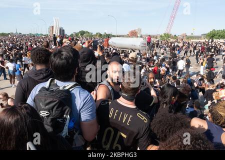 Thousands of people assess the situation as a fuel truck plunges through a crowd of peaceful protesters in Minneapolis, MN. May 31, 2020. (Photo by Tim Evans/NurPhoto) Stock Photo