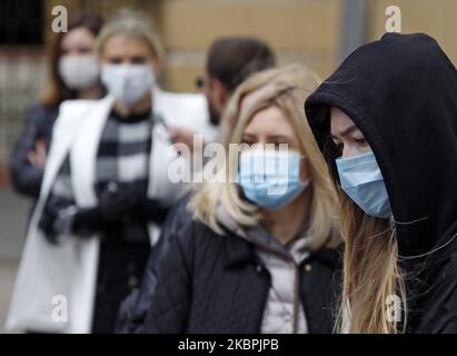 People wearing protective masks amid the Covid-19 coronavirus epidemic are seen in Kyiv, Ukraine, on 01 June, 2020. As on 01 June 2020 in Ukraine in total 24 012 laboratory-confirmed cases of the coronavirus COVID-19 desease, including 718 of fatal, according the Ukraine's Ministry of Health website. (Photo by STR/NurPhoto) Stock Photo