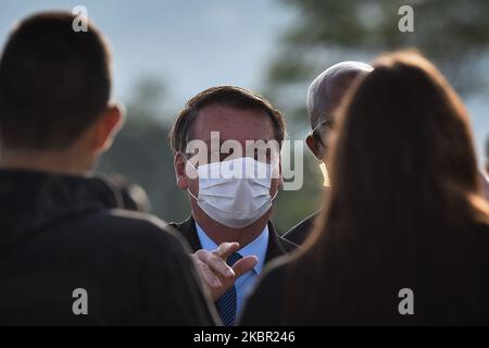 Wearing a protective face mask, Brazil's president Jair Bolsonaro arrives for the National Flag Raising ceremony and greet his supporters in front of Alvorada Palace amid the Coronavirus (COVID-19) pandemic, in Brasilia, Brazil, on Tuesday, June 9, 2020. (Photo by Andre Borges/NurPhoto) Stock Photo