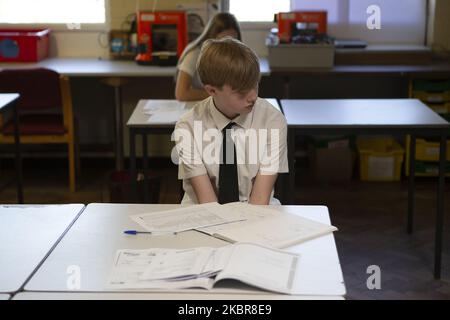 A year 10 pupil with work in front of him. Ortu Gable Hall School in Corringham, Essex return after a long break due to the COVID-19 pandemic on Tuesday 16th June 2020. (Photo by Jacques Feeney/MI News/NurPhoto) Stock Photo