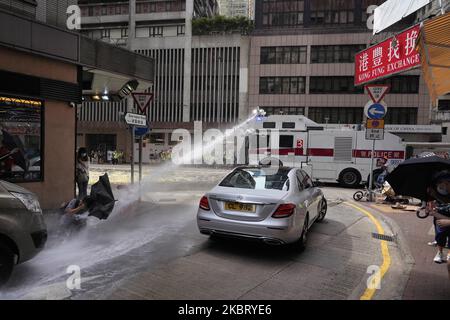 Police use a water cannon to disperse protesters in Hong Kong, China, on July 1, 2020. The protest is against new national security law in Hong Kong on the 23rd anniversary of city handover from British to China. (Photo by Yat Kai Yeung/NurPhoto) Stock Photo