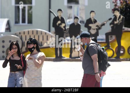 People wearing protective masks as a preventive measure against the coronavirus COVID-19 on street in Vinnytsia, Ukraine on July 2, 2020 (Photo by Maxym Marusenko/NurPhoto) Stock Photo