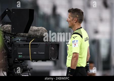 Referee Daniele Orsato looks at the VAR during the Serie A football match n.34 JUVENTUS - LAZIO on July 20, 2020 at the Allianz Stadium in Turin, Piedmont, Italy. (Photo by Matteo Bottanelli/NurPhoto) Stock Photo