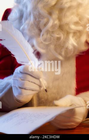 Santa Claus checks his list twice, North Pole Stock Photo