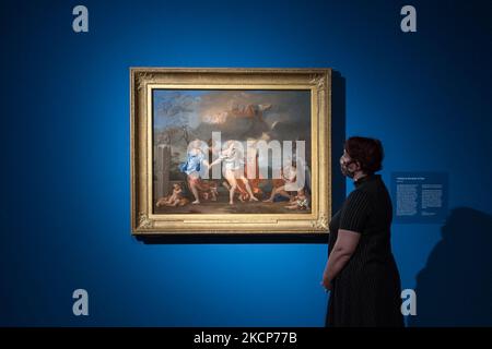 LONDRA, REGNO UNITO - 07 OTTOBRE 2021: Un membro dello staff della galleria guarda un dipinto dal titolo "A Dance to the Music of Time" (c.. 1634) dell'artista classico francese Nicolas Poussin (1594–1665) durante una rassegna stampa per la prossima mostra 'Poussin and the Dance' (9 ottobre 2021 – 2 gennaio 2022) alla National Gallery, il 07 ottobre 2021 a Londra, Inghilterra. (Foto di Wiktor Szymanowicz/NurPhoto) Foto Stock