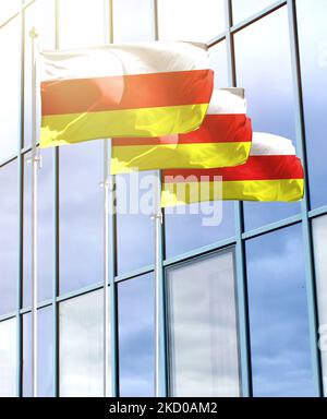 Palettoni con bandiera dell'Ossezia del Sud di fronte al business center Foto Stock