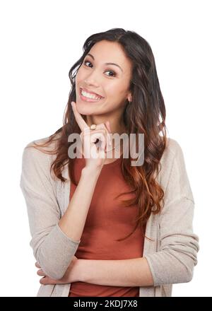 Ceneri un tale charmer. Ritratto di una giovane donna felice che guarda premurosa mentre si posa in studio. Foto Stock