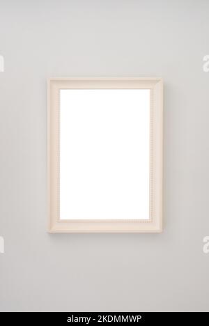 Cornice fotografica vuota beige appesa alla parete Foto Stock
