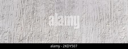 Intonaco grigio chiaro con disegno astratto di scanalature verticali ruvide Foto Stock