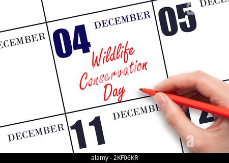 Dicembre 4th. Scrittura a mano testo Wildlife Conservation Day in data di calendario. Salvare la data. Vacanza. Concetto giorno dell'anno. Foto Stock