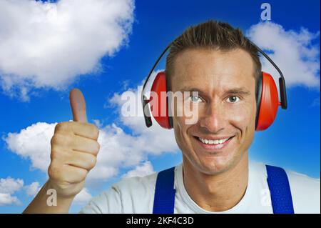 Bauarbeiter mit Gehörschutz Foto Stock