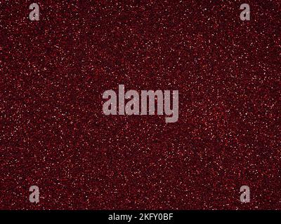 Rosso scuro glitter. Perfetto sfondo olografico o motivo di scintillante brillantezza per la decorazione e il design di Natale, Capodanno, San Valentino Foto Stock