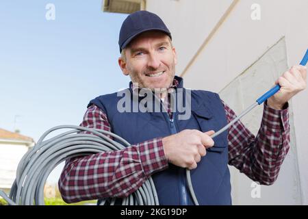 Lavoratore in un sito in costruzione Foto Stock