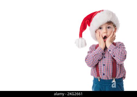 Buon bambino ragazzo con cravatta e sospende in tessuto Babbo Natale, concetto di Natale Foto Stock