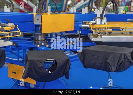 Carosello automatico per macchine per la stampa a schermo in Print Office Foto Stock