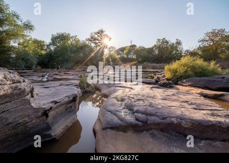 Aille river,iron red bridge and ruined sawmill, in 'plaine des Maures' natural reserve, in Vidauban, in France, in Europe. Stock Photo