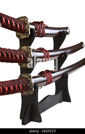 Il samurai spade su un piedistallo di legno Foto Stock