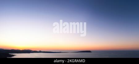 Spagna, Isole Baleari, Minorca, Vista panoramica del cielo su Cap di Cavalleria al tramonto Foto Stock