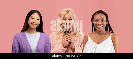 Tre girlfriends multirazziali che si posano su sfondo rosa studio Foto Stock