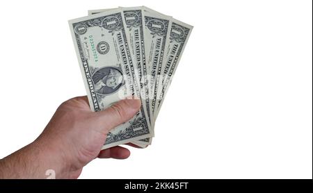 La mano che tiene le fatture del un-dollaro. vista dall'alto, mano maschile che tiene dollari su sfondo bianco. Copia spazi. Foto Stock