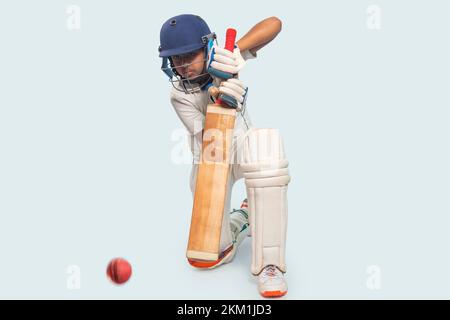 Ritratto di ragazzo che colpisce un colpo durante un gioco di cricket Foto Stock