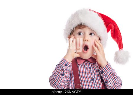 Buon bambino ragazzo con cravatta e sospende in tessuto Babbo Natale, concetto di Natale Foto Stock