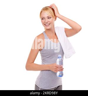 Shes dedicati al fitness. Foto studio di una giovane donna in forma in abbigliamento sportivo isolato su bianco. Foto Stock