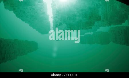 Vista dal fondo del mare con il sole che splende attraverso lo spessore dell'acqua. Movimento. Formazioni di pietra sott'acqua Foto Stock