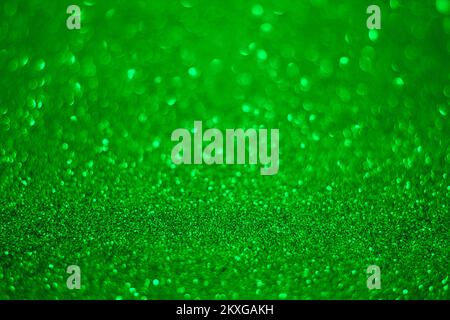 Green glitter background.Texture delle particelle di glitter verde. Foto Stock