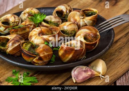 Lumache cotte di Borgogna - Escargots de Bourgogne Foto Stock