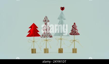 Alberi di Natale creativi fatti a mano su bastoni di legno con sfondo bianco Foto Stock