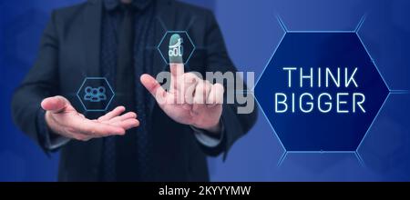 Didascalia concettuale pensare più grande. Parola per potere sognare e visualizzare che cosa potete realizzare Foto Stock