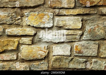 Parete di pietra grigia e beige, buona per lo sfondo Foto Stock