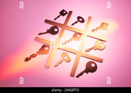 TIC-TAC-Toe con tasti su sfondo caldo Foto Stock