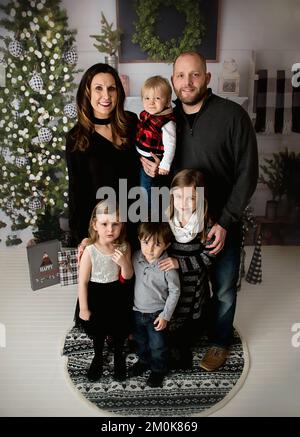 Bambini e famiglie a Natale Foto Stock