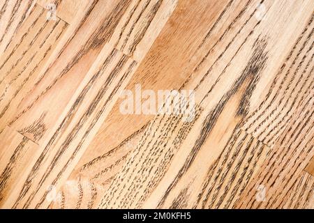 Legno massello di frassino incollato sotto vernice piano tavolo piano primo piano in legno fondo. Foto Stock