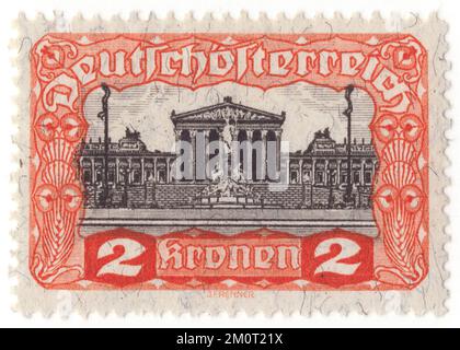 AUSTRIA - 1919: Vermiglio da 2 krone e francobollo nero raffigurante l'edificio del Parlamento. Rilascio della prima Repubblica. Il Parlamento austriaco a Vienna è il luogo in cui le due case del Parlamento austriaco svolgono le loro sessioni. L'edificio si trova sul viale Ringstraße, nel primo distretto di Innere Stadt, vicino al Palazzo Hofburg e al Palazzo di Giustizia. Fu costruita per ospitare le due camere del Consiglio Imperiale (Reichsrat), la legislatura bicamerale della parte cisleitana (austriaca) dell'Impero Austro-Ungarico Foto Stock