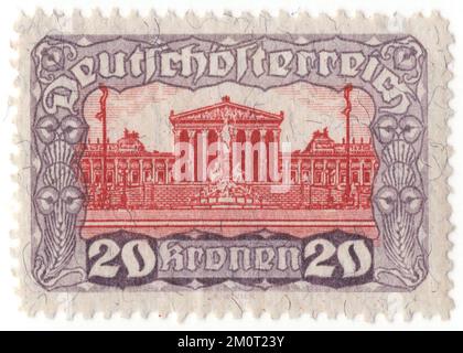 AUSTRIA - 1920: Lilla da 20 krone e francobollo rosso raffigurante l'edificio del Parlamento. Rilascio della prima Repubblica. Il Parlamento austriaco a Vienna è il luogo in cui le due case del Parlamento austriaco svolgono le loro sessioni. L'edificio si trova sul viale Ringstraße, nel primo distretto di Innere Stadt, vicino al Palazzo Hofburg e al Palazzo di Giustizia. Fu costruita per ospitare le due camere del Consiglio Imperiale (Reichsrat), la legislatura bicamerale della parte cisleitana (austriaca) dell'Impero Austro-Ungarico Foto Stock