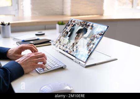 Virtual Hybrid Meeting in Office. Business Man Video Conference Foto Stock