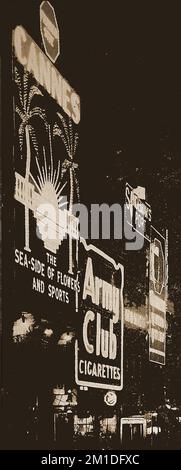 Una fotografia notturna di insegne pubblicitarie illuminate a Piccadilly Circus Londra negli anni '30, tra cui un annuncio per le sigarette Army Club e Cannes, Francia che si pubblicizzava un 'The Seaside of Flowers & Sports' ---- Une photographie nocturne d’enseignes publicitaires illuminées à Piccadilly Circus Londres avec une publicité pour Cannes, en France, qui se annoncait comme « le bord de mer des fleurs et du sport » Foto Stock