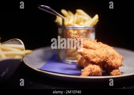 Bar cibo ristorante pollo e patatine fritte Foto Stock