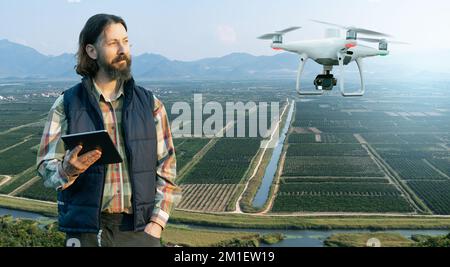 Il coltivatore controlla il drone. Agricoltura intelligente e agricoltura di precisione Foto Stock