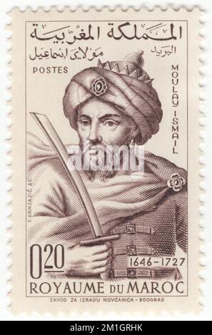 MAROCCO - 1963 marzo 3: Francobollo di seppia da 20 centesimi raffigurante re Moulay Ismail. Tercentenario di Meknes come capitale Ismaili. Meknes è una delle quattro città imperiali del Marocco, situata nel nord del Marocco centrale e la sesta città più grande per popolazione del regno. Fondata nel 11th ° secolo dagli Almoravidi come insediamento militare, Meknes divenne la capitale del Marocco sotto il regno del sultano Moulay Ismail (1672-1727), figlio del fondatore della dinastia Alaouite. Moulay Ismail creò un massiccio palazzo imperiale e dotò la città di ampie fortificazioni Foto Stock