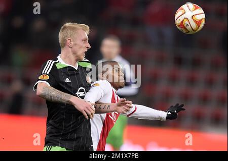 20141211 - LIEGE, BELGIO: Il centrocampista di Feyenoord Lex IMMERS e Darwin Andrade di Standard combattono per la palla durante una partita tra Standard de Liege e la squadra olandese Feyenoord l'ultimo giorno della fase di gruppo del torneo Europa League, nel gruppo G, nello stadio di Liege, giovedì 11 dicembre 2014. FOTO DI BELGA YORICK JANSENS Foto Stock