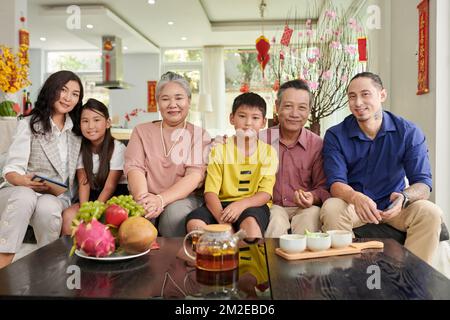 Three generation of big family celebrating Chinese New Year at home Stock Photo