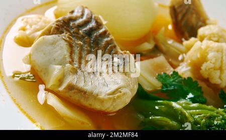 Dahomey Fish Stew  from Benin .African cuisine, Fried fish simmered in red palm oil Stock Photo