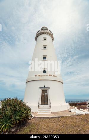 Cape Willoughby lighthouse viewed against blue sky with clouds on a day, Kangaroo Island, South Australia Stock Photo